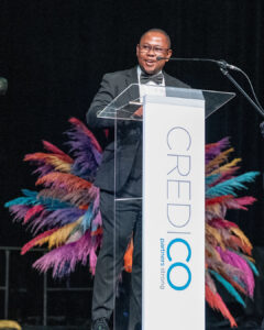 Duisand Mokoena speaks on stage from behind a podium during the South Africa Awards Gala in March 2025