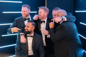 National and Regional Consultants pose for a smiling photo in the photo booth during the 2026 Limitless Kickoff Gala