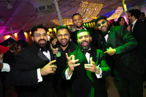 Five independent business owners in tuxedos cheer at the 2026 Limitless Kickoff Gala